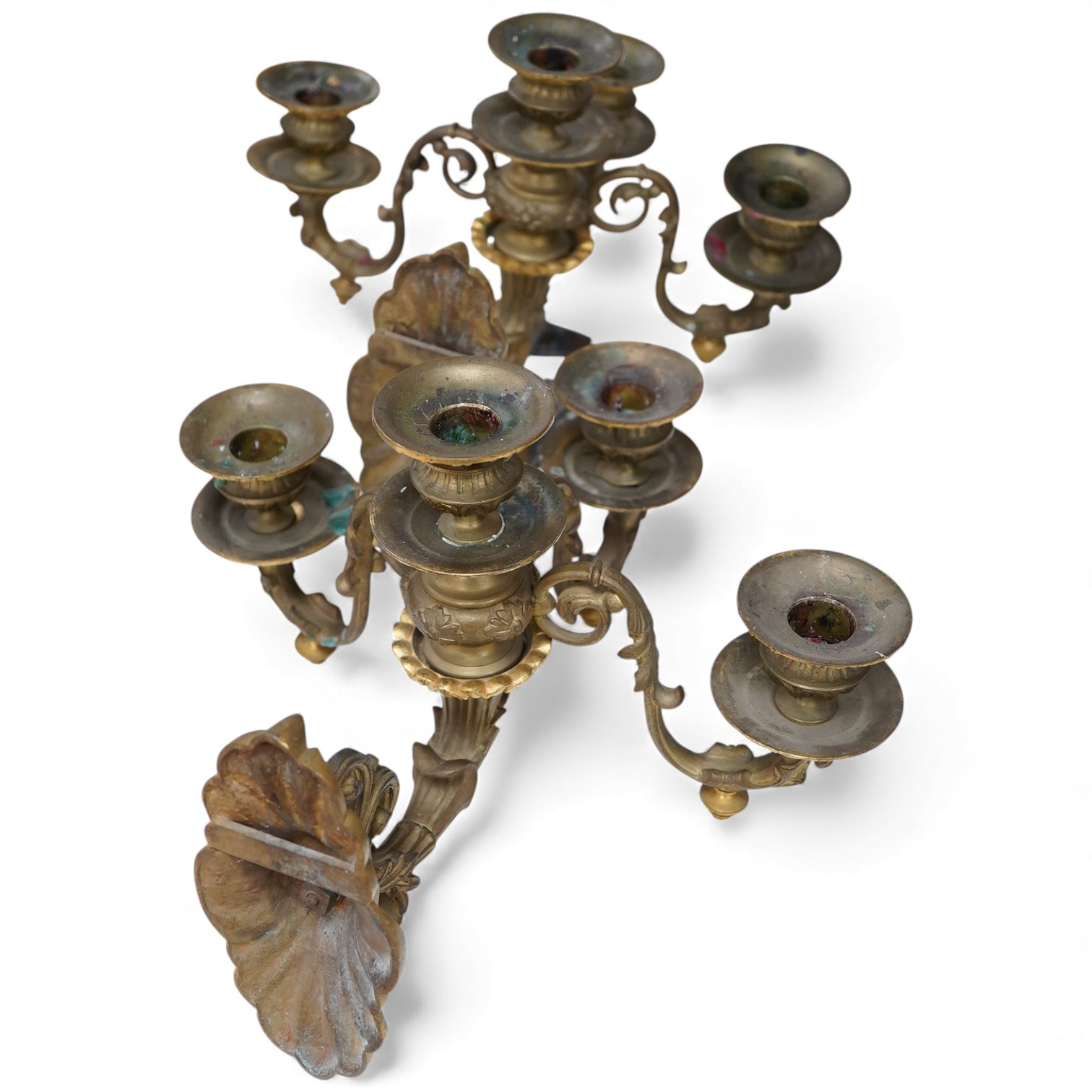 A pair of cast brass three branch wall sconces, 27cm deep